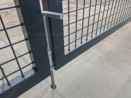 Drop rod gate stopper on a new welded wire fence