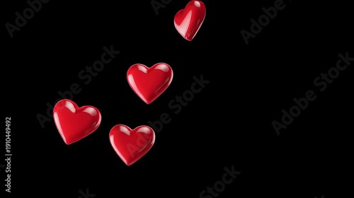 Red Hearts Falling Against Black Background.