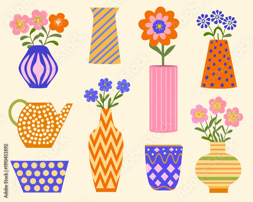 Colorful floral arrangements in patterned vases and a watering can