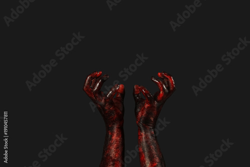 Hands of zombie on black ba...