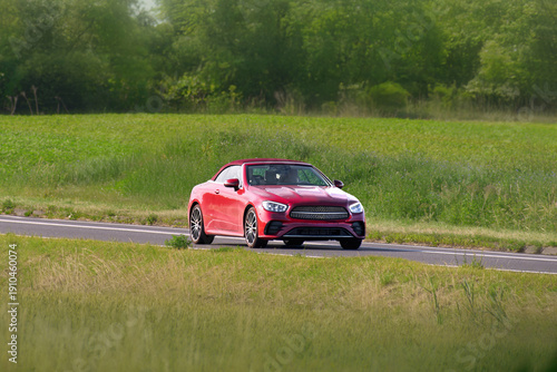 Wallpaper Mural Customized red roadster driving on asphalt highway Torontodigital.ca