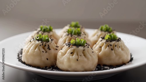 Wallpaper Mural Delicious Steamed Dumplings Topped with Black Sesame Seeds and Scallions on White Plate in Dim Lighting Torontodigital.ca