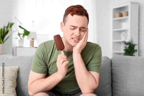 Young man with ice-cream su...