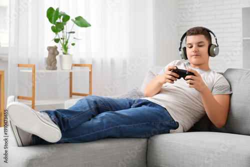 Teenage boy in headphones p...