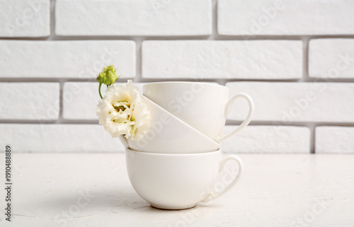 Simple cups with flower on ...