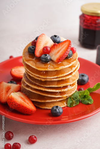 Plate with tasty pancakes a...