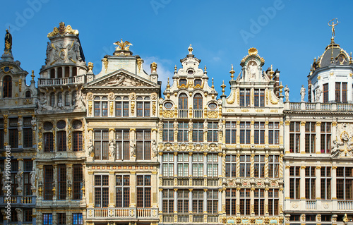 Opulent Baroque architecture detail on a building facade in Brussels. Many rectangular windows evoke concept of privacy and rich living. Rococo decoration on wealthy central apartments in Bruxelles