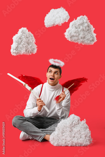Young man dressed as Cupid ...