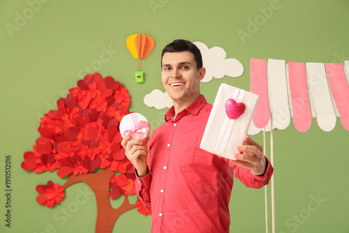 Young man with gift boxes n...