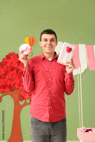 Young man with gift boxes n...