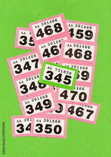 Vintage raffle tickets on a bright coloured background with one highlighted in a different colour.