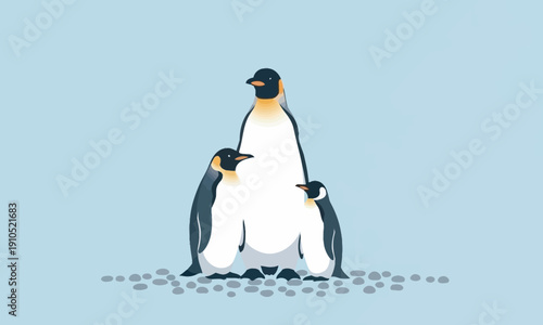 A minimalist illustration of a penguin family, consisting of one large adult and two smaller chicks standing on a bed of grey pebbles. The scene is set against a soft blue background, evoking a cold, 