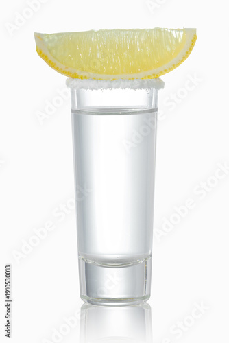 Photos Shot glass with tequila, salt and lemon slice isolated on white background with