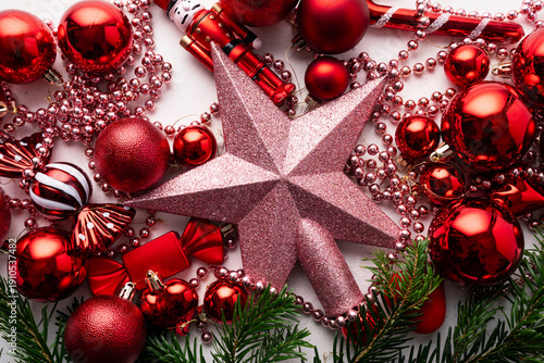 Christmas flat lay background with red ornaments, star and festive decorations