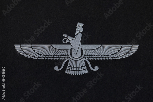 The Faravahar is symbols of Zoroastrianism and  a national symbol for Iranians. Light symbol on dark background