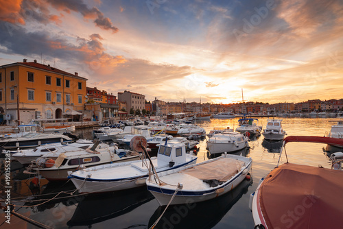 Wonderful morning view of old  Rovinj town with multicolored buildings and yachts moored along embankment, Croatia.