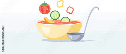 Freshly prepared gazpacho soup in a bowl with ingredients falling in