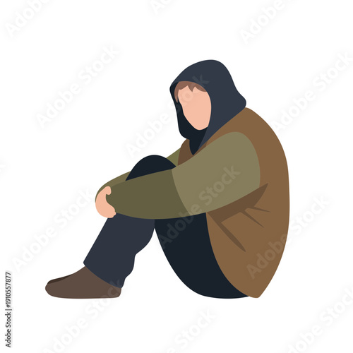 Huddled figure sitting alone in hooded jacket