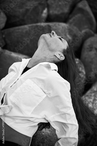 Wallpaper Mural Black and white portrait of woman leaning back against rocky backdrop Torontodigital.ca