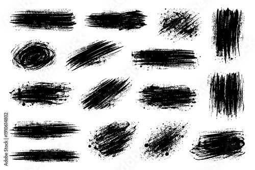Set of grunge black brush strokes textured paint splatter design elements.