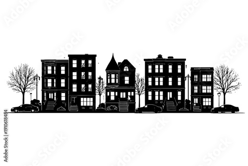 Silhouette of urban architecture with historic row houses and leafless trees.