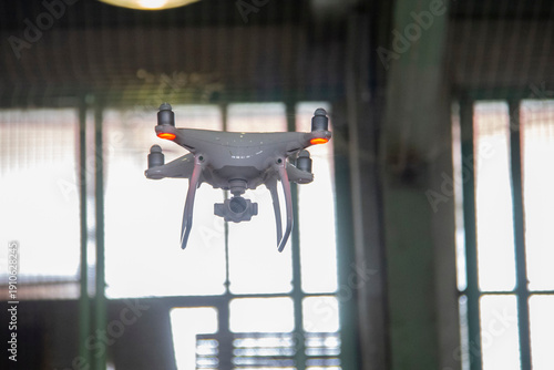 Wallpaper Mural Quadcopter or drone flying indoors while filming Torontodigital.ca