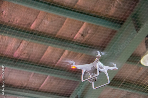 Wallpaper Mural Quadcopter or drone flying indoors while filming Torontodigital.ca