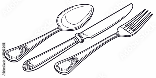 A set of silverware including a spoon, knife, and fork arranged neatly on a table.