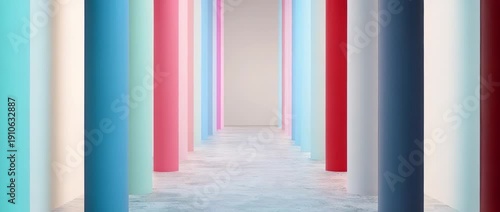 Row of colorful pastel vertical columns receding into the distance on  concrete floor