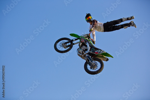Motorcycle rider performing dangerous midair stunt trick in Almaty