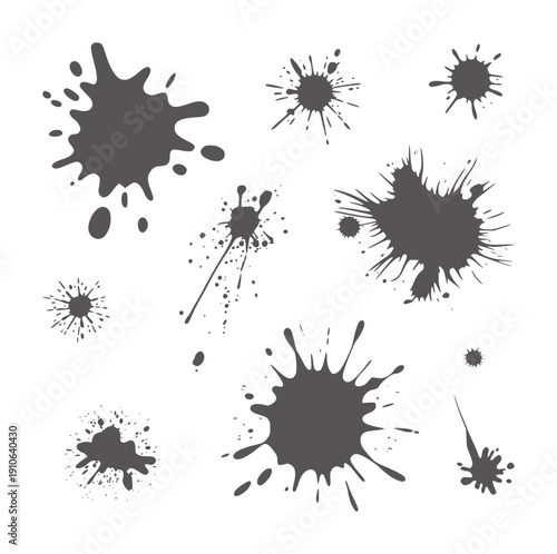 Collection of dark gray ink splatters and splashes paint blot