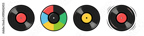 Collection of four vinyl records with different colored labels and one spinning