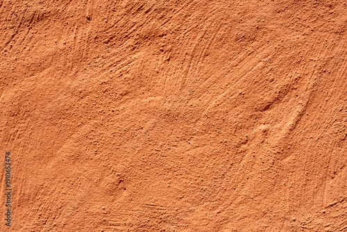 Rough orange terracotta stucco wall texture background