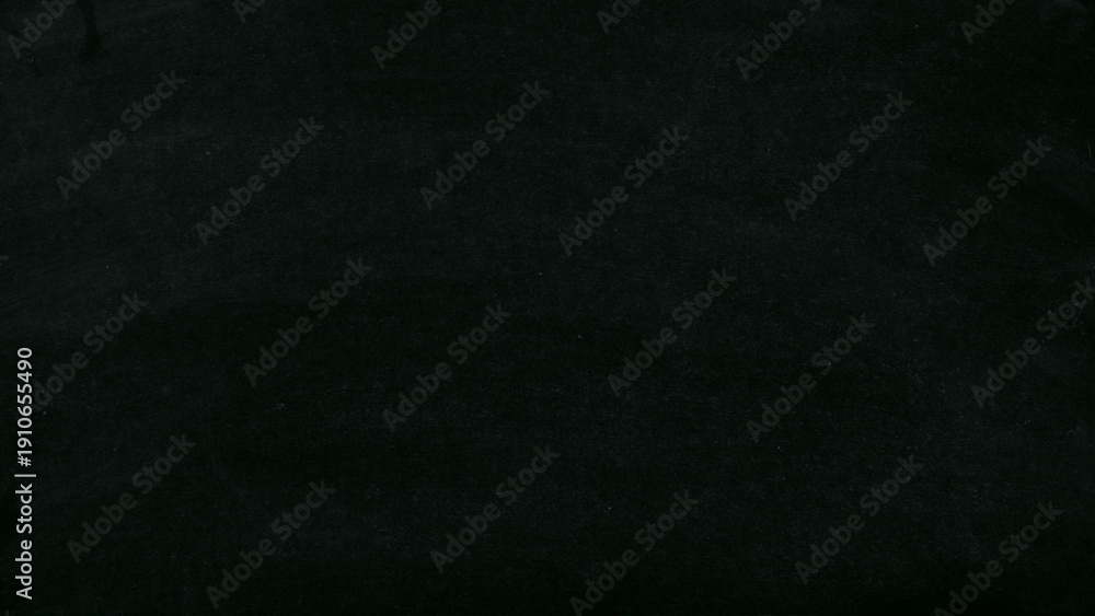 Fototapeta premium Classic black chalkboard texture with subtle chalk dust and soft surface variations. High-resolution dark slate background ideal for education designs, restaurant menus, typography layouts, mockups.