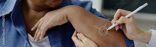 Tableau sur toile Website header shot of middle aged Black woman receiving dermatological examinat