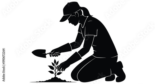 A woman is carefully planting a small seedling in the earth kneeling with gardening tools a striking silhouette high quality