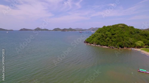 Wallpaper Mural Quiet bay with turquoise water and lush island landscape near Labuan Bajo Flores Indonesia, aerial medium reveal Torontodigital.ca