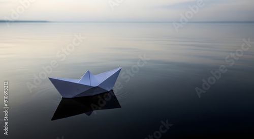 Wallpaper Mural Paper boat in vast empty water surface, solitude concept Torontodigital.ca