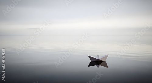 Wallpaper Mural Paper boat in vast empty water surface, solitude concept Torontodigital.ca