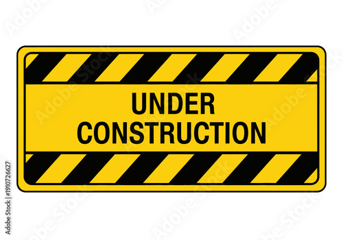 Construction site warning sign with caution stripes and bold text indicating under construction status viewed from directly ahead