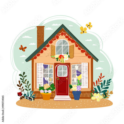Small house with a red roof and a beautiful garden full of blooming spring flowers Plant