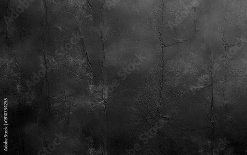 Black abstract wall, dark putty texture as background. 