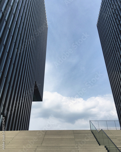 Clean minimal graphic linear modern architecture highrise buildings against blue sky in Düsseldorf Duesseldorf Dusseldorf, Germany on sunny day