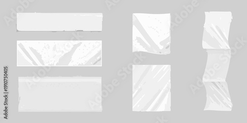 Abstract composition of torn white paper pieces arranged on a gray background