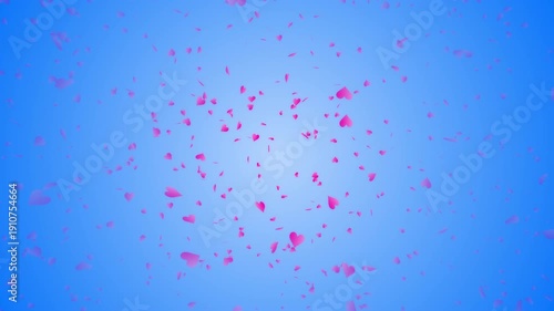 Pink heart shapes being lit up and falling down on blue gradient background. Abstract background for Happy Valentine's day and wedding ceremony.