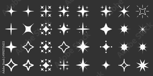 Collection of sparkling starbursts and glitter effects on a black background
