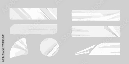 Abstract shapes in shades of gray and white resembling torn paper
