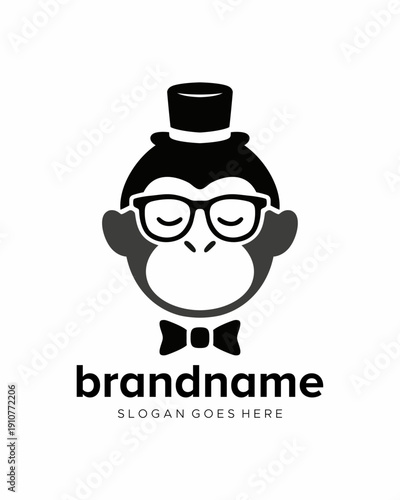 vector logo of a monkey head wearing glasses, a hat and a bow tie
