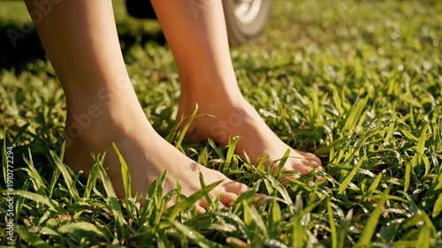 Barefoot steps out of rustic van onto grassy ground travel freedom