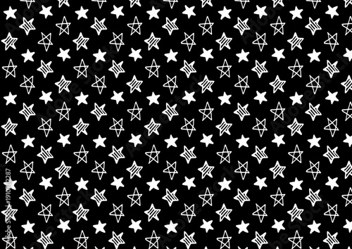 白黒の手描き星イラストパターン背景素材